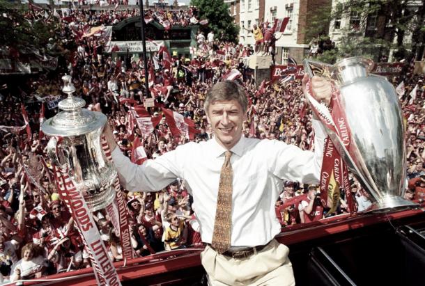 Arsene Wenger celebrates with both the Premier League & FA Cup following Arsenal's 1998 double success