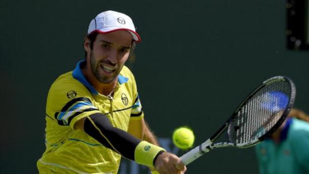 Mikhail Kukushkin, of Kazakhstan, returns a shot from Kei Nishikori during their match at the BNP Paribas Open tennis tournament, Sunday, March 13, 2016, in Indian Wells, Calif. (AP Photo/Mark J. Terrill) 