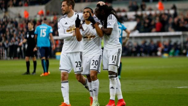 Montero, centre, celebrates scoring for Swansea City last season | Photo: ITV