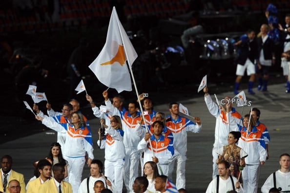 Baghdatis holds his country's flag aloft during the 2012 Olympics opening ceremony (Photo: Getty Images/Laurence Griffiths)