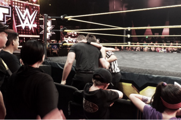 Bayley needed assistance getting to the back. Photo- Twitter