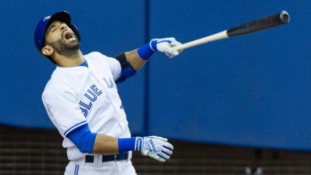 Jose Bautista reacts after taking a swing against the Boston Red Sox during Saturday afternoon's game at Olympic Stadium in Montreal.