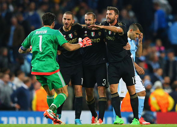 Robust, brave, fearless: Bonucci (far left) alongside his defensive team-mates and Gianluigi Buffon during Juve's 2-1 win over City last season.