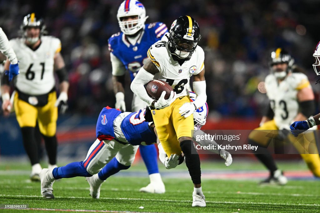 Diontae Johnson #18 of the Pittsburgh Steelers runs with the football during the second half of the NFL wild-card playoff football game against the Buffalo Bills at Highmark Stadium on January 15, 2024 in Orchard Park, New York. (Photo by Kathryn Riley/Getty Images)