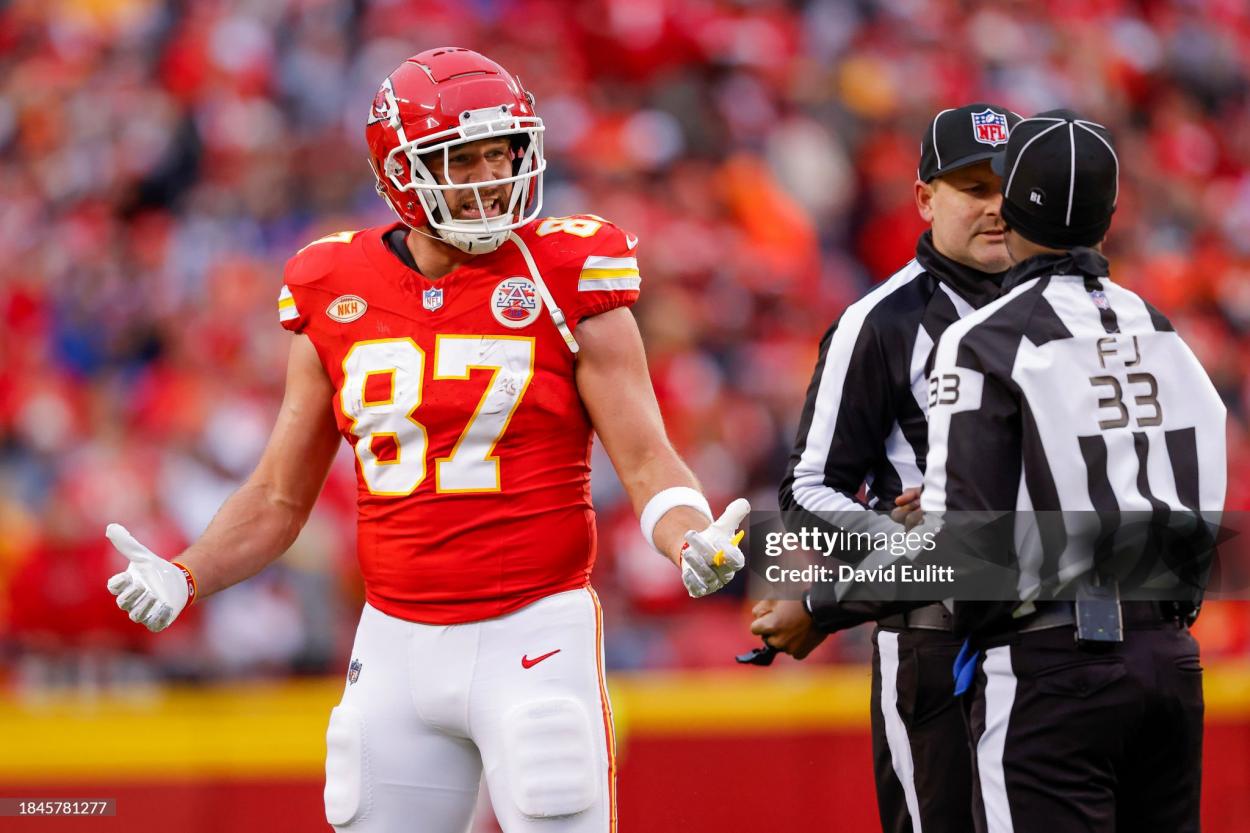 Travis Kelce #87 of the Kansas City Chiefs reacts with the referee during the first half of the game against the Buffalo Bills at GEHA Field at Arrowhead Stadium on December 10, 2023 in Kansas City, Missouri. (Photo by David Eulitt/Getty Images)