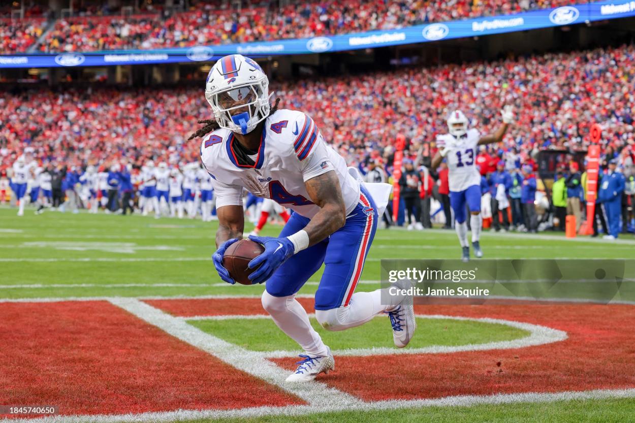 James Cook #4 of the Buffalo Bills reacts after scoring a touchdown during the first half of the game against the Kansas City Chiefs at GEHA Field at Arrowhead Stadium on December 10, 2023 in Kansas City, Missouri. (Photo by Jamie Squire/Getty Images)