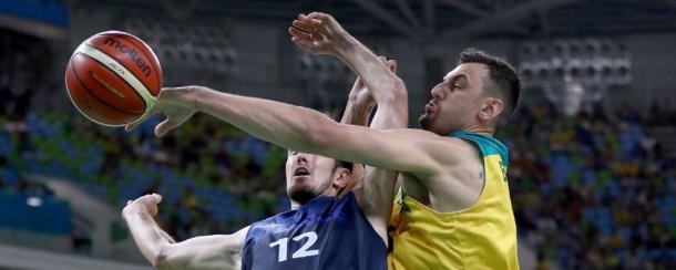 Andrew Bogut blocking France's Nando de Colo's (12) shot. Photo: Elsa/Getty Images