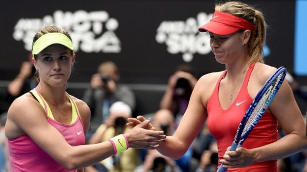 Maria Sharapova (R) and Eugenie Bouchard shake hands after their last meeting at the 2015 Australian Open, which Sharapova won 6-3, 6-2. | Photo: Andy Brownbill/Associated Press