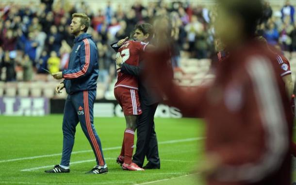 Adomah embraces Aitor Karanka after a falling-out between the pair | Photo: Gazette