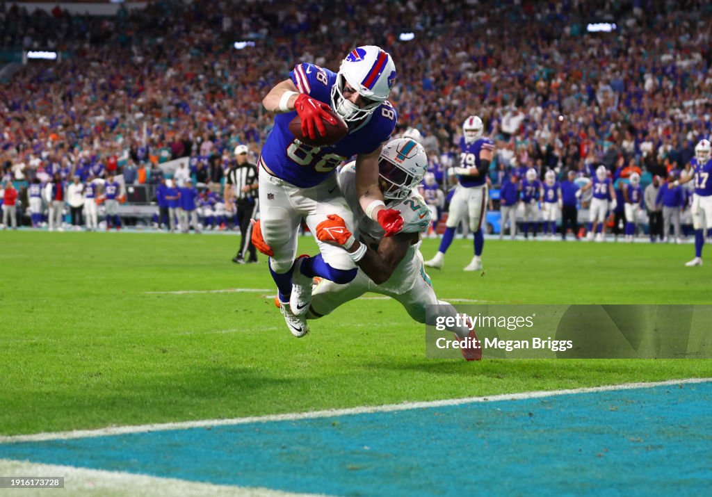 Dawson Knox #88 of the Buffalo Bills dives for the end zone to score a touchdown during the fourth quarter against the Miami Dolphins at Hard Rock Stadium on January 07, 2024 in Miami Gardens, Florida. (Photo by Megan Briggs/Getty Images)
