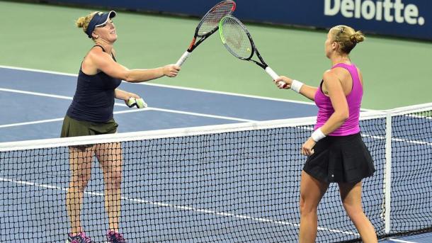 Brengle (left) and Rogers (right) tap racquets after the conclusion of their match. Photo: Andrew Ong​