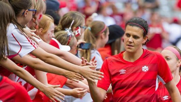 Legend Christine Sinclair bonding with fans after a solid game with Canada. Source: Rich Lam/Getty Images