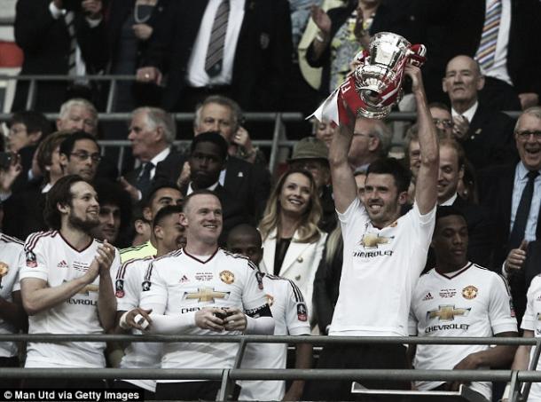 Carrick lifts the FA Cup in what could be his last game in a Man United shirt - Picture: Getty