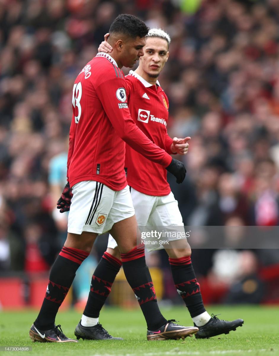 Antony consoling Casemiro after his dismissal against Southampton. (Photo by Nathan Stirk/Getty Images)