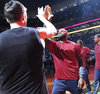 Cleveland Cavaliers forward LeBron James (23) gives a high five to forward Kevin Love (0) before the game. Photo:Bob DeChiara-USA TODAY Sports  