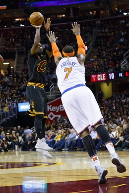 Cleveland Cavaliers Guard Kyrie Irving doing a shot attempt over New York Knicks Forward Carmelo Anthony. Photo Courtesy of Rick Osentoski-USA TODAY Sports.