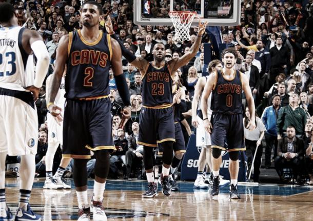 The Cavaliers celebrate after Kyrie Irving hits a big shot against the Dallas Mavericks. (Glenn James/NBAE/Getty Images)