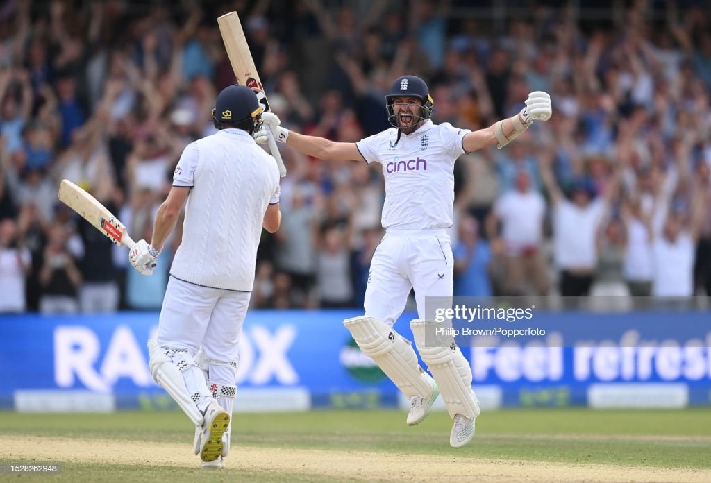 Wood celebrates the winning runs with Chris Woakes