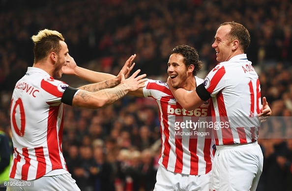 Marko Arnautovic, Ramadan Sobhi and Charlie Adam celebrate as Alfie Mawson scores an own goal during the Premier League match against Swansea City. | Photo: Michael Regan/Getty Images