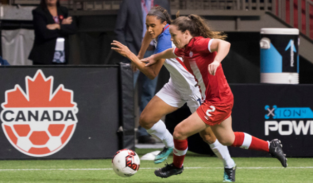 Canada's Allysha Chapman battles with United States forward Lynn Williams in a friendly match between the two sides. They will now play together for the North Carolina Courage in the NWSL. | Photo: Rich Lam - Getty Images