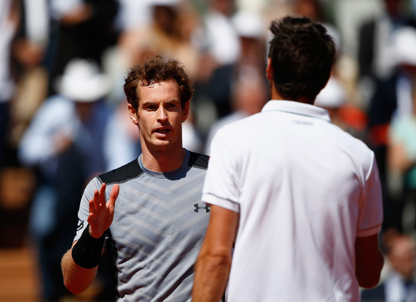 Murray and Chardy shake hands at the net following their fourth round match at the French Open in 2015 (Photo by Julian Finney / Getty Images)