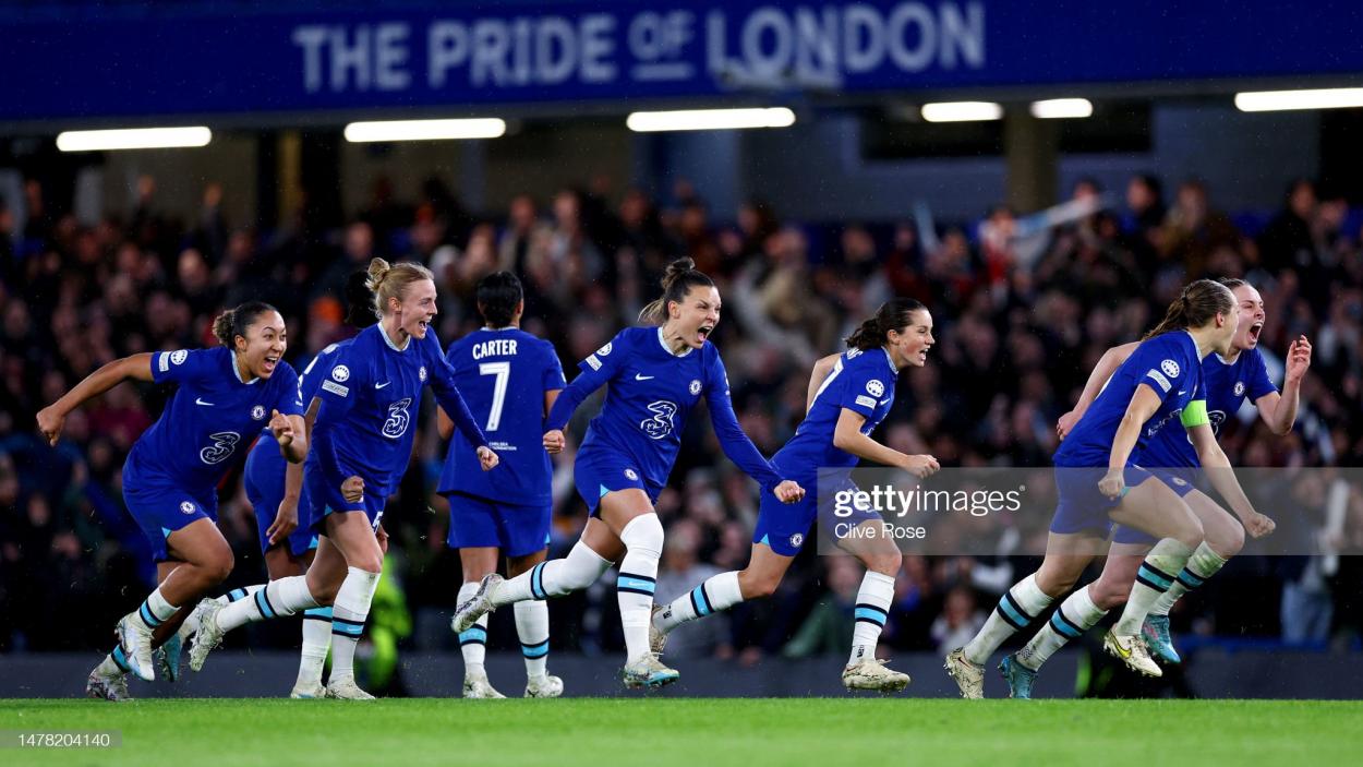 Chelsea players celebrate victory in the penalty shootout during the UEFA Women's Champions League quarter-final 2nd leg match between Chelsea FC and Olympique Lyonnais at Stamford Bridge on March 30, 2023 in London, England. (Photo by Clive Rose/Getty Images)