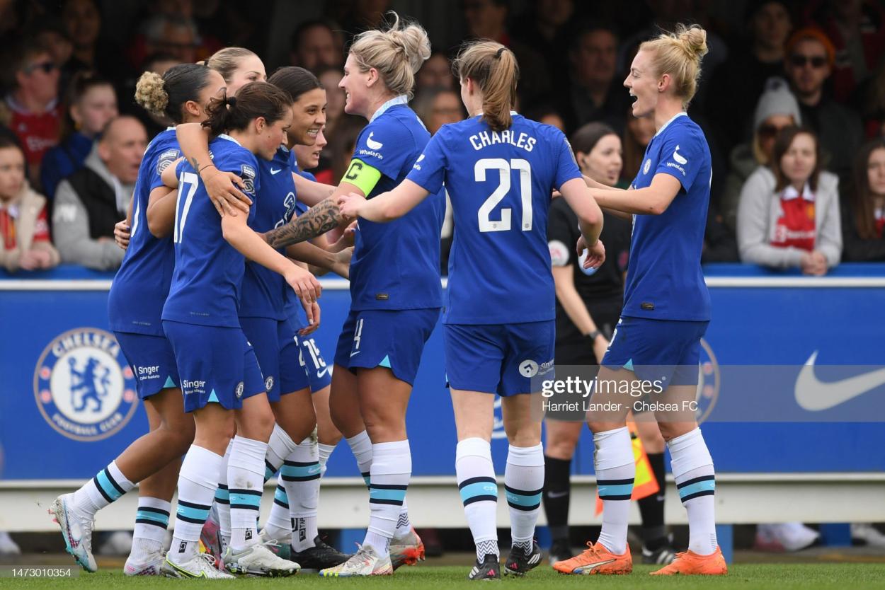 Sam Kerr of Chelsea celebrates with teammates after scoring her team's first goal during the match between Chelsea and <strong><a  data-cke-saved-href='https://www.vavel.com/en/football/2023/03/11/womens-football/1140340-leicester-city-vs-everton-womens-super-league-preview-gameweek-15-2023.html' href='https://www.vavel.com/en/football/2023/03/11/womens-football/1140340-leicester-city-vs-everton-womens-super-league-preview-gameweek-15-2023.html'>Manchester United</a></strong> at Kingsmeadow. (Photo by Harriet Lander - Chelsea FC/Getty Images)