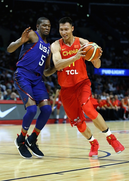 China's Yi Jianlian driving past Team USA's Kevin Durant. Photo: Sean M. Haffey/Getty Images