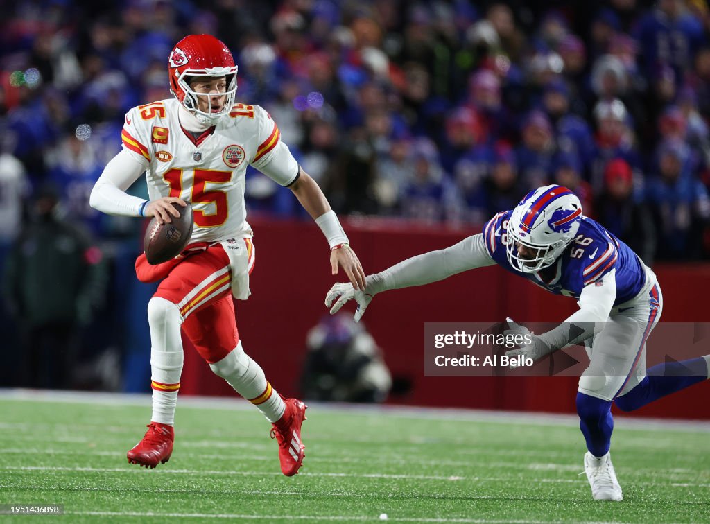 Patrick Mahomes #15 of the Kansas City Chiefs eludes Leonard Floyd #56 of the Buffalo Bills during their AFC Divisional Playoff game at Highmark Stadium on January 21, 2024 in Orchard Park, New York. (Photo by Al Bello/Getty Images)