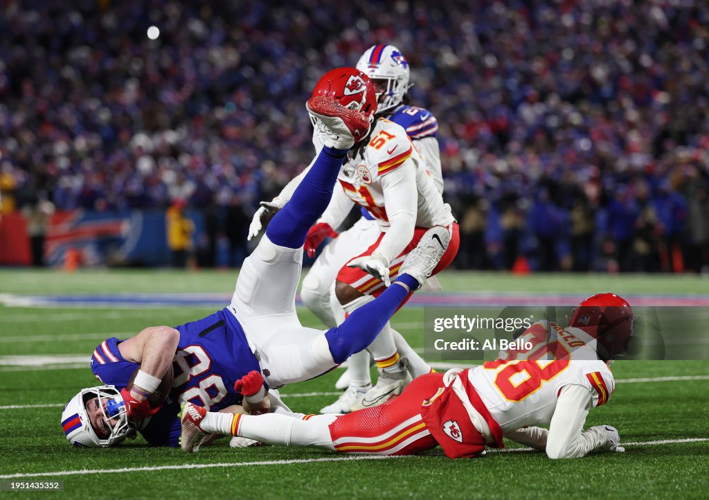Dawson Knox #88 of the Buffalo Bills is tackled by L'Jarius Sneed #38 of the Kansas City Chiefs during their AFC Divisional Playoff game at Highmark Stadium on January 21, 2024 in Orchard Park, New York. (Photo by Al Bello/Getty Images)