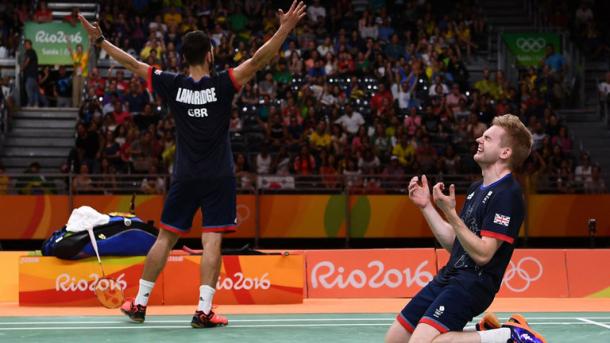 Chris Langridge and Marcus Ellis of Great Britain celebrate after winning badminton bronze. | Photo: PA