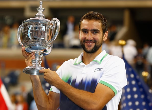 Cilic holding his first Grand Slam singles title at the US Open in 2014 (Photo by Julian Finney / Getty Images)