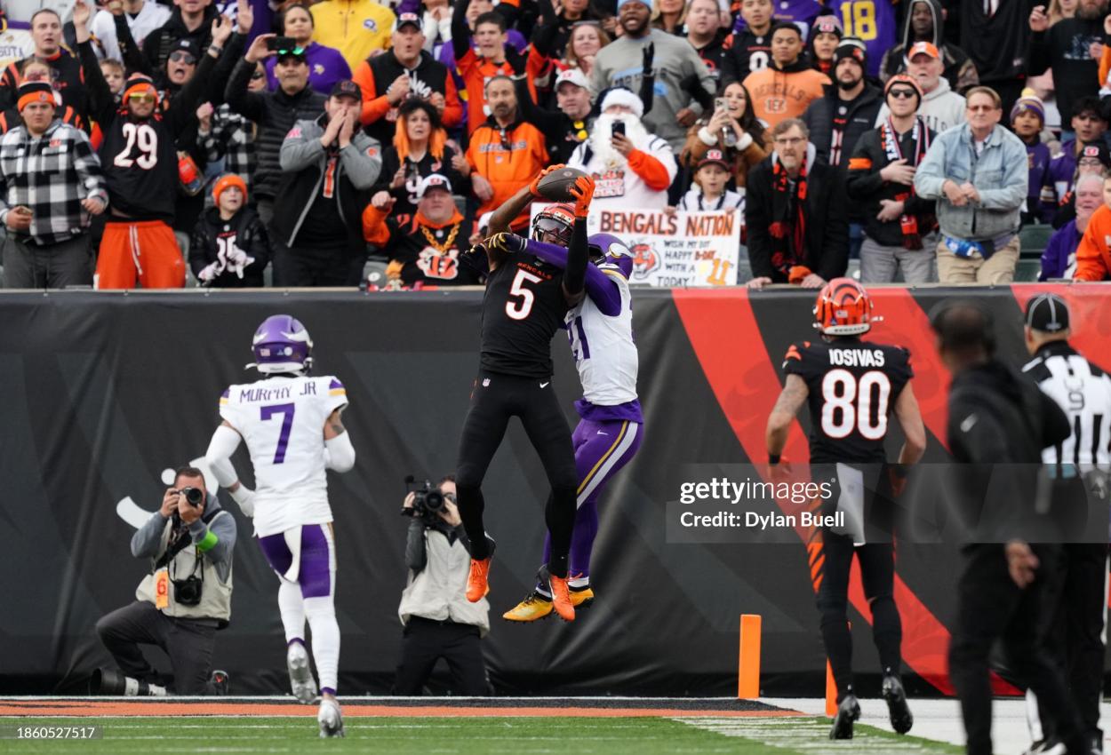 Tee Higgins #5 of the Cincinnati Bengals catches the ball for a touchdown in the fourth quarter of the game against the Minnesota Vikings at Paycor Stadium on December 16, 2023 in Cincinnati, Ohio. (Photo by Dylan Buell/Getty Images)