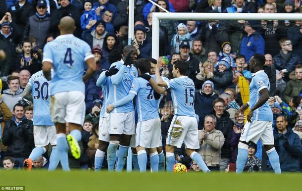 Manchester City players celebrate Yaya Toure's opening goal (photo: Reuters)