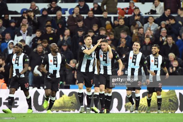 Newcastle players celebrate Ciaran Clark's winning goal against Bournemouth