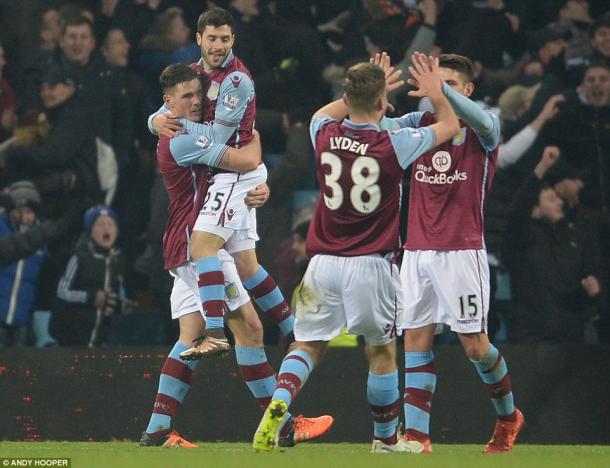 Villa players celebrate the first goal (photo: Andy Hooper)