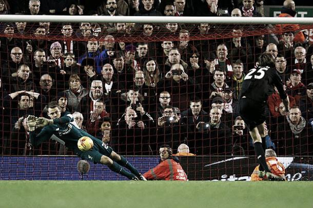 Peter Crouch sees his penalty saved by Simon Mignolet (image: The Telegraph)