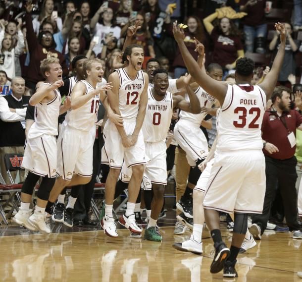 Winthrop players celebrate after clinching their first NCAA bid since 2010/Photo: Chuck Burton/Associated Press