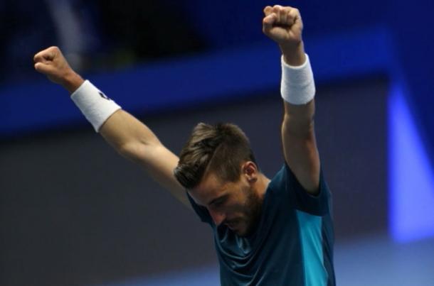 Photo: Igor Russak/NurPhoto via Getty Images-Damir Dzumhur falls to his knees in elation.