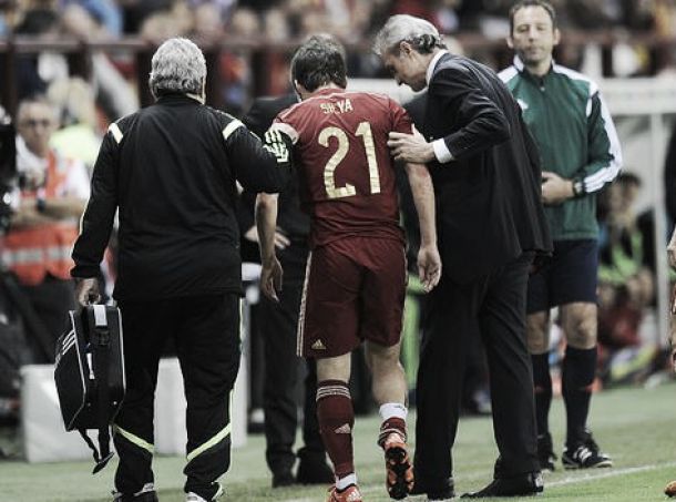 Silva (pictured, centre) limping off during international duty with his native Spain, where he's expected to feature in this summer's European Championships. | Photo: Getty