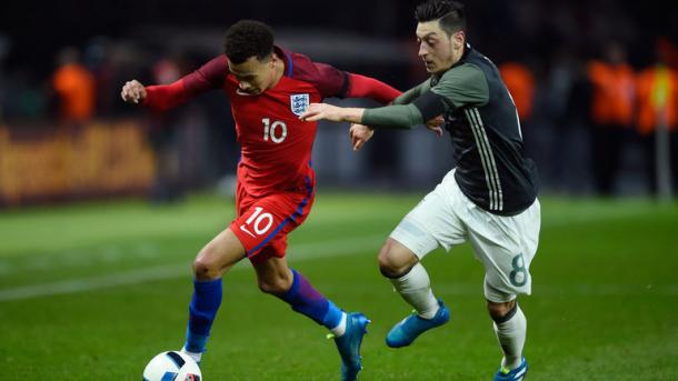 Alli in a battle with Arsenal's Mesut Ozil for England - Germany last month | Photo: Getty Images