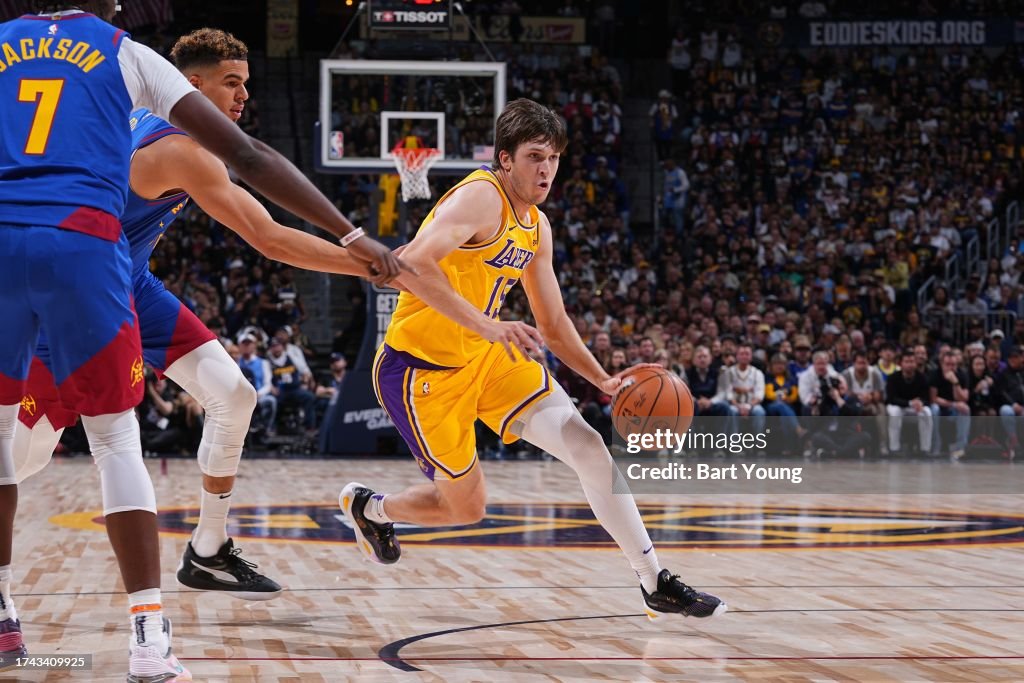 Austin Reaves #15 of the Los Angeles Lakers dribbles the ball during the game against the Denver Nuggets on October 24, 2023 at the Ball Arena in Denver, Colorado. Copyright 2023 NBAE (Photo by Bart Young/NBAE via Getty Images)