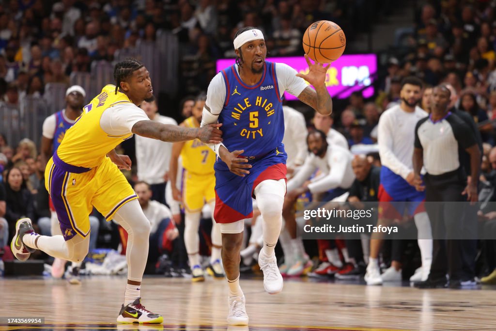 Kentavious Caldwell-Pope #5 of the Denver Nuggets steals the ball from Cam Reddish #5 of the Los Angeles Lakers in the second half of the NBA Opening night game at Ball Arena on October 24, 2023 in Denver, Colorado. (Photo by Justin Tafoya/Getty Images)