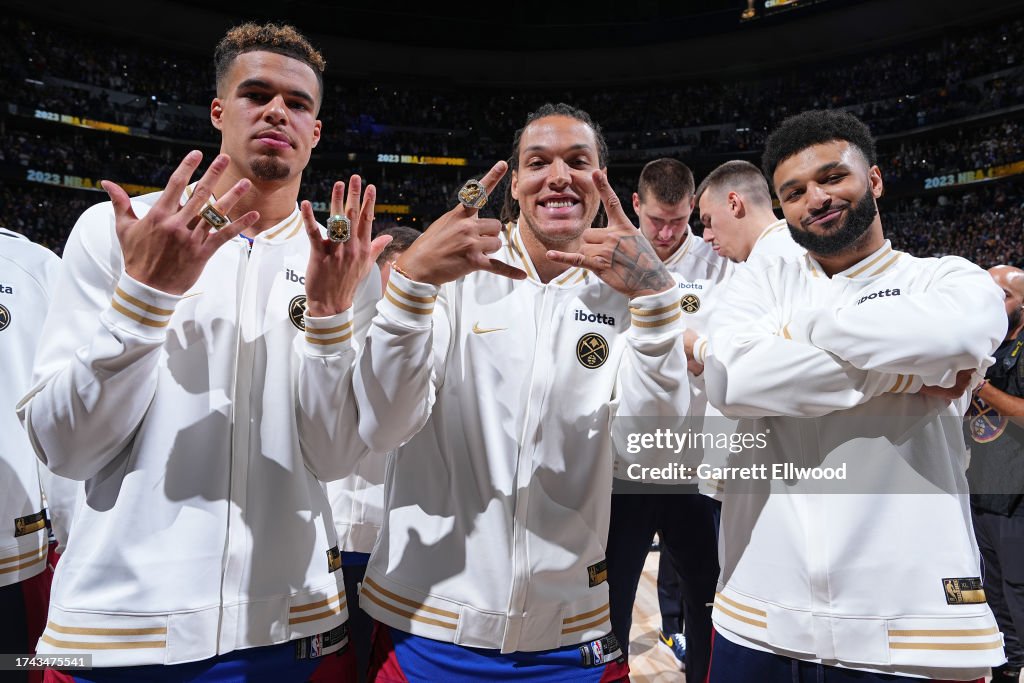 Michael Porter Jr. #1, Aaron Gordon #50 and Jamal Murray #27 of the Denver Nuggets pose for a photo with their championship rings before the game against the Los Angeles Lakers on October 24, 2023 at the Ball Arena in Denver, Colorado. Copyright 2023 NBAE (Photo by Garrett Ellwood/NBAE via Getty Images)