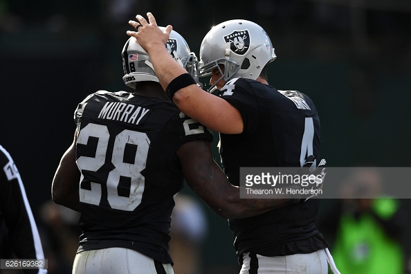 Derek Carr and Latavius Murray celebrate a touchdown during their win over the Carolina Panthers in Week 12. (Source: 
