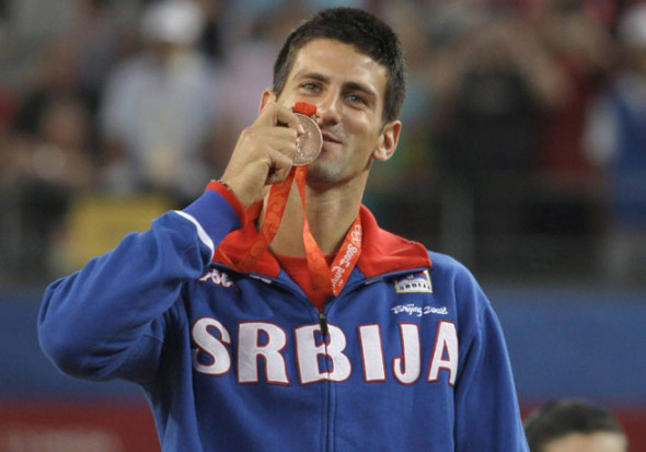 Djokovic posing with his Olympic bronze medal (Source: Sportskeeda)