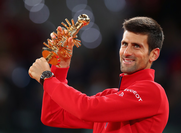 Djokovic posing with his second Mutua Madrid Open title (Photo by Julian Finney / Getty Images)