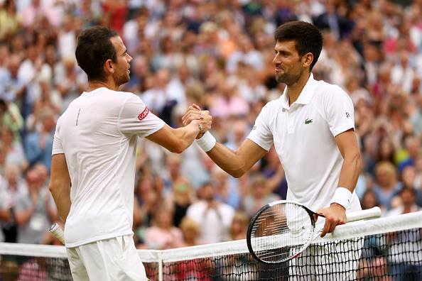 The two players shook hands at the net after the match (Photo by Shaun Botterill / Getty)