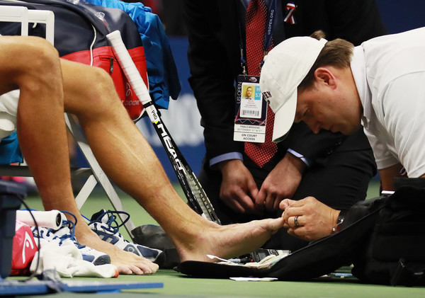 Djokovic receiving a medical time trailing two sets to one and 1-3 down in the fourth set (Photo by Michael Reaves / Getty Images)