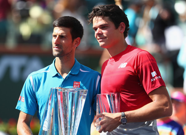 Djokovic and Raonic holding their trophies following the aftermath of their final in Indian Wells back in March (Photo by Julian Finney / Getty Images)